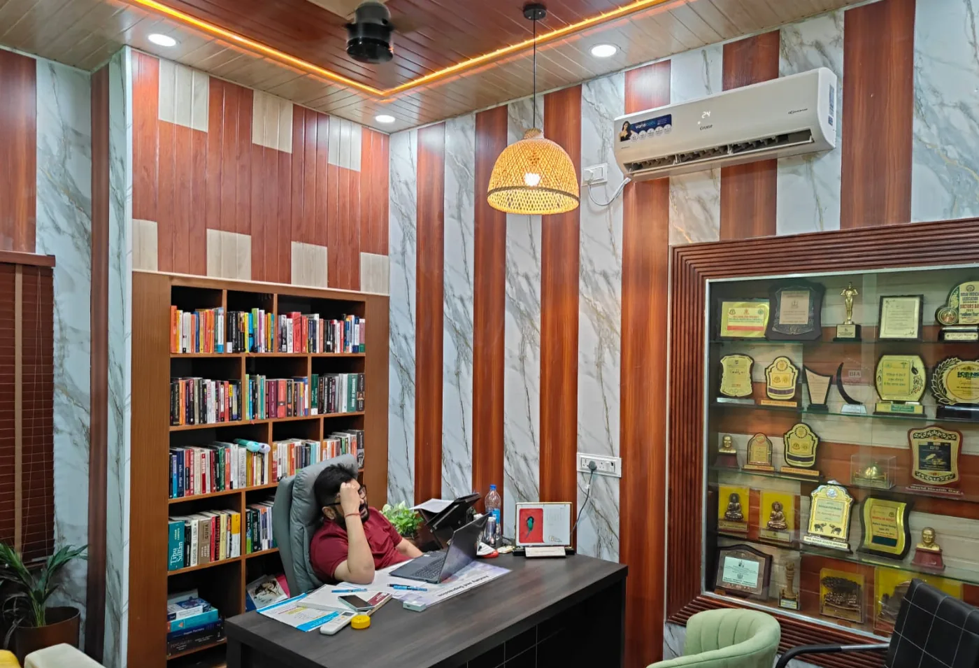 Dr. Kumar's consulting room at Healthy Minds India, with the practice's awards
